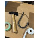 large metal meat hook and hatchet