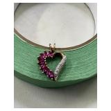 3 grams sterling silver pendant red/clear stones