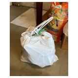 garbage bag full of plastic clothes hangers