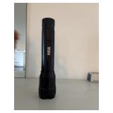 NRA heavyduty flashlight works  downstair room