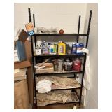 black metal shelf, with contents on wheeled