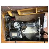 singer sewing machine in wood cabinet