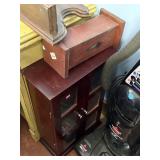 glass front storage cabinet with wall shelf