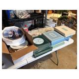 shelf of avon decorative plates, and box of
