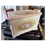small wooden chest, rose pattern on front,