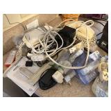 lot of household electric cords, phones, cables