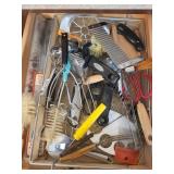 drawer with metal organizing tray, serving utensis
