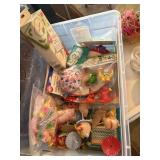 tote of birthday candles, plates, daisy candy