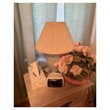 lamp, faux flowers, alarm clock, tissues