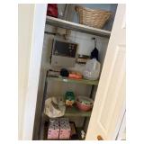 contents of closet in kitchen, green metal shelf