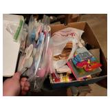 box of craft supplies, cross stitch books, foam