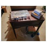 singer sewing machine in wood cabinet, thread