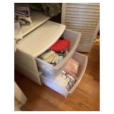 2 sterilite containers, 2 drawers of table linens