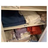 2 shelves of blankets - seashell bath mat & curtas