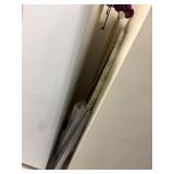 ironing board , 4 rolls of plastic window covering