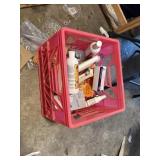 pink crate, dog shampoos, metal shelf rake, etc.