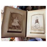 antique photo album with very old photos