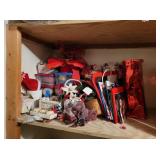 shelf of craft, topiaries, paints, faux flowers,