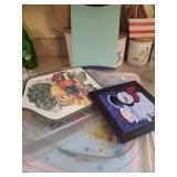 lot of plastic trays, glass cutting board, 2 other