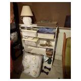 contents of shelf unit, place mats, curtains,