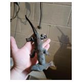 cast iron lizard eating a fish, 10' long