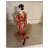 japanese doll and large umbrella