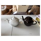 2 teapots, chip on spout of brown pot   garage