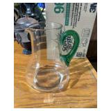 clear glass pitcher with green handle 7't x 5.5' w