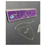 2 sterling silver necklaces, set of earrings, and