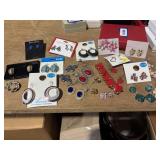 20 pairs of earrings and 1 bracelet