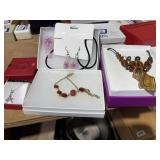 4 necklaces and 2 sets of earrings