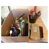 box of kitchen utensils, peelers, slicers, can