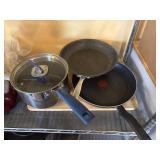 large wood cutting board, heavy stock pot with lid