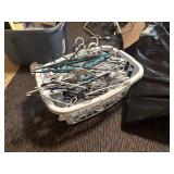 laundry basket of plastic hangers   basement