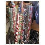 12 new rolls of Christmas wrapping paper & 3 used