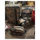 4  pc luggage, tapestry pattern, large one on