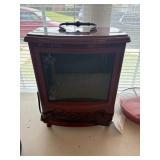 small fireplace like heater, red electric