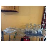 wine glasses, mugs, and several glass pickle