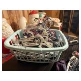 laundry basket filled with plastic hangers