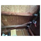 4 fishing rods, oil filter wrench on ceiling