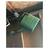 plastic watering can   back porch