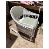 white wicker rocking chair