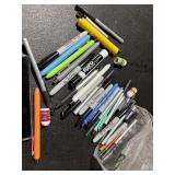 bag of sharpies, pens, tiny lip balms, highlighter