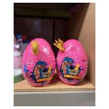 2 dinosaur gummy candy filled eggs,