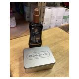 bottle of bronzer with razor cleaner