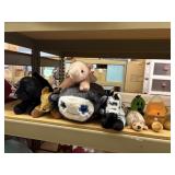 lot of stuffed animals, pig, dog, deer, zebra,