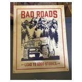 metal sign BAD ROADS LEAD TO GOOD STORIES