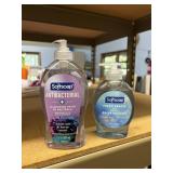 2 bottles of hand soap, lid on 1 is broke