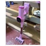 bright pink TIKOM stick vacuum with accessories