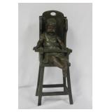 A Bronze Child on a High Chair by Steiner